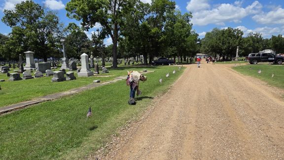 Placing US Flags at Evergreen Cemetary